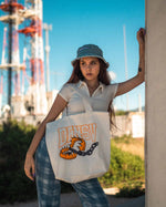 Canvas Tote bag comes in Black or Cream with Streetwear brand logo graphic design screen printed on front side modeled by male model and female model with vintage retro inspiration inspo