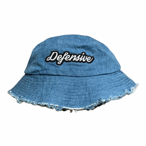 Our denim bucket hat gives any streetwear look a vintage twist. Our denim bucket hat also modern flare with distressed edges and our signature Defensive embroidery.